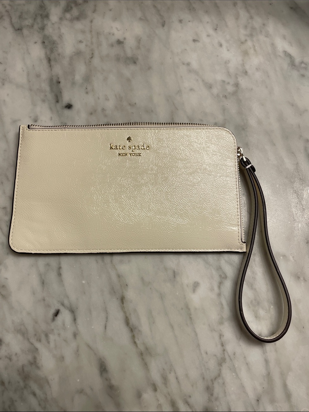 kate spade Cream Leather Zip Wristlet with Gold Logo